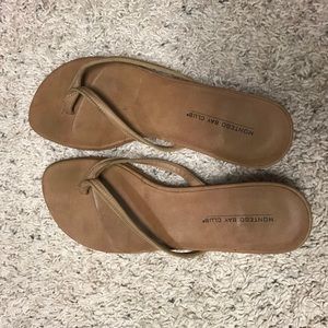 Tan flip flops with small heel